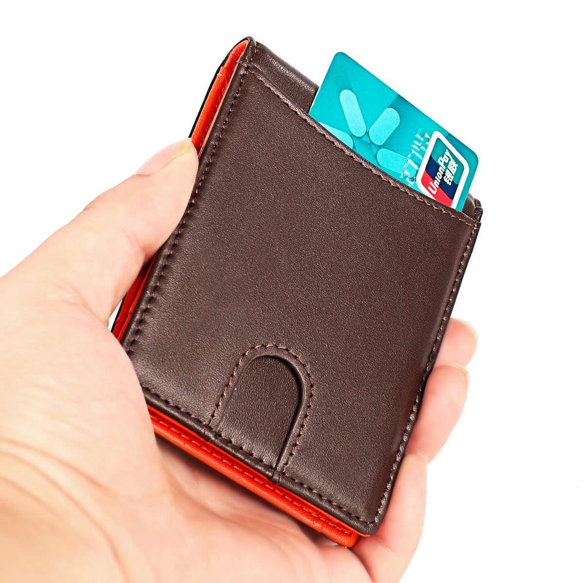 Hand holding a brown leather wallet with a card inserted on a white background