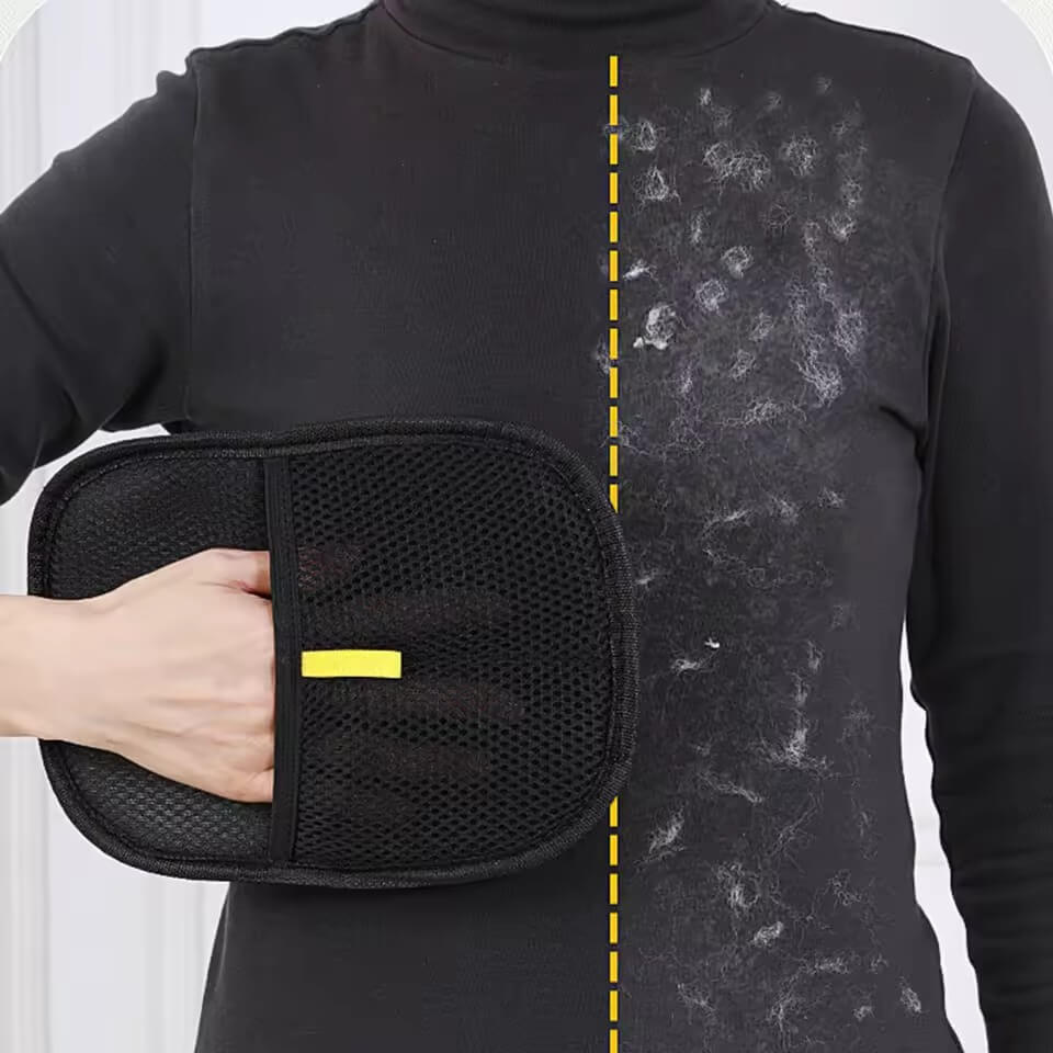 Person holding a black mesh pad with yellow label on a black turtleneck shirt with visible sweat stains.